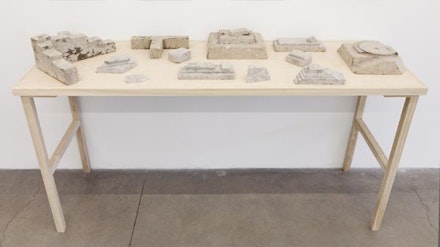 Ishmael Randall Weeks, “Quoin,” 2012. Cast and sculpted individual days of newspaper, table. Dimensions variable. Courtesy of the artist and Eleven Rivington.