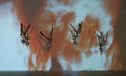 Carolee Schneemann, <i>Flange 6rpm</i>. Foundry poured aluminum sculptures, motors 6rpm each unit; DVD projections floor to ceiling of foundry firing. Photo: Susan Alzner. 