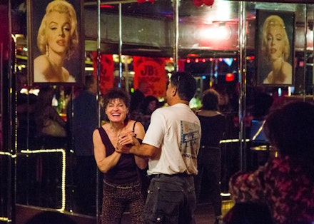 Boundaries are crossed when one bartender's night off frees her up to dance with the regulars.