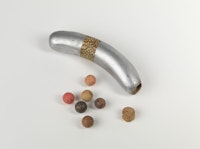 Robert Watts, “Flux Rattle from the Yam Festival Delivery Event,” 1962–3. Plastic hotdog, cork, clay balls, and paint, 14 x 3.2 x 3.8 cm. Courtesy and © Robert Watts Estate, New York. Photo Bruce M. White.