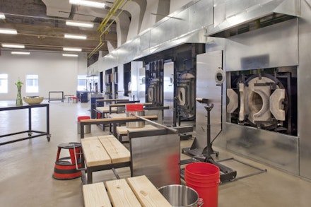 Massive, energy efficient furnaces dominate UrbanGlass's studio space. Photo: UrbanGlass.

