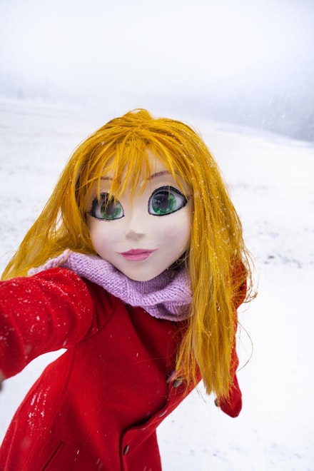 Laurie Simmons, “Yellow Hair/Red Coat/Snow/Selfie,” 2014. 20 × 28.75 inches.