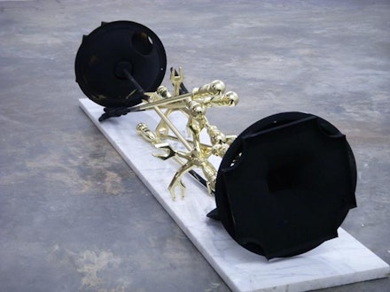 “Norfolk Southern,” 2007. Brass fireplace tools, marble, soot, 14 ̋× 47 ̋× 14 ̋. Courtesy of artist.