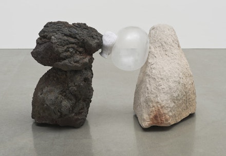 Gabriel Kuri, “stop start exponential growth 05,” 2014. Volcanic rock, Cameron boulder, socks, inflated condom, 18.25 × 15.5 × 33.07 ̋. Courtesy the artist and Regen Projects, Los Angeles.