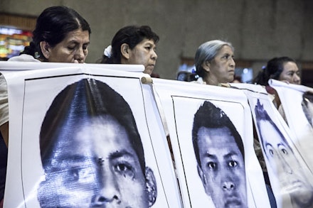 “Memoria Verdad y Justicia para Ayotzinapa” by Isabel Sanginés (flic.kr/p/pqUDPD), used under CC BY 2.0 / Desaturated from original.