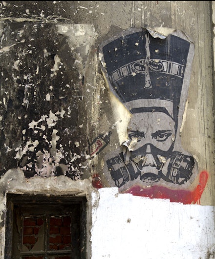 El Zeft, Nefertiti in a Gas Mask, 2012. Spray paint on concrete. Cairo, Egypt.