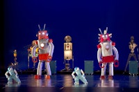 Dancers in robot suits share the stage with Nao robots and a mechanical orchestra in Blanca Li’s <em>ROBOT</em>. Photo: Laurent Philippe.