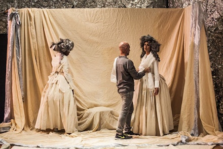 Walter Dundervill drapes fabrics on Omagbitse Omagbemi and Jessie Gold at Dundervill’s <em>Arena</em>. Photo: Maria Baranova.
