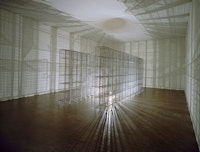 Mona Hatoum, <em>Light Sentence</em>, 1992. 36 wire mesh compartments, electric motor, light bulb, 1.98 × 1.85 × 4.90 m. ©Centre Pompidou, Musée national d’art moderne, Paris. Photo: Centre Pompidou, Mnam-CCI / Dist RMN-GP.