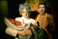 Photograph of A Man's Best Friend by Katherine Owens. Left, Bruce DuBose as Andy Warhol, right, Tom Lenaghen as Sluggo the clown.
