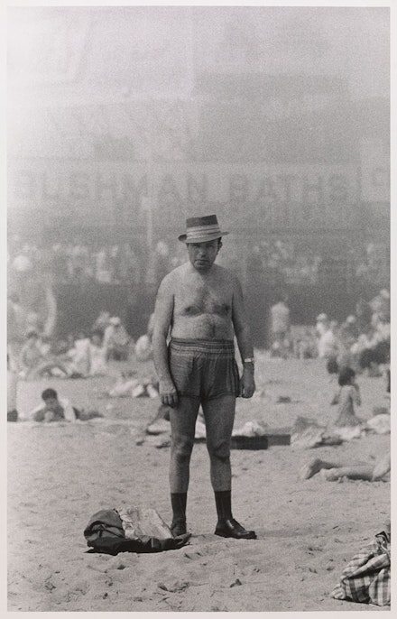 Diane Arbus, <em>Man in hat, trunks, socks, and shoes, Coney Island, N.Y.</em>, 1960. © The Estate of Diane Arbus, LLC. All Rights Reserved. Courtesy The Metropolitan Museum of Art.