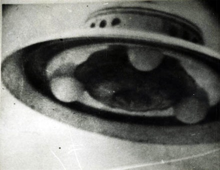 Photograph of an unidentified flying object taken in 1952 by George Adamski a prolific American photographer of UFOs. Adamski claimed to have several encounters with aliens beginning in the late ‘40s, and even stated that he had been taken aboard alien spacecrafts and traveled to different planets. His claims drew the attention of several skeptics, and after a series of investigations, his photographs were eventually discredited. Image courtesy of Tony Oursler’s personal archive.