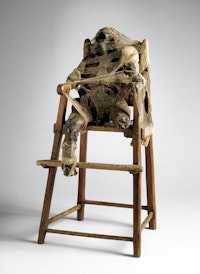 Bruce Conner, <em>CHILD</em>, 1959. Wax, nylon, cloth, metal, twine, and high chair. The Museum of Modern Art, New York. © 2016 Bruce Conner / Artists Rights Society (ARS), New York. Digital image © 2016 The Museum of Modern Art. Photo: John Wronn.