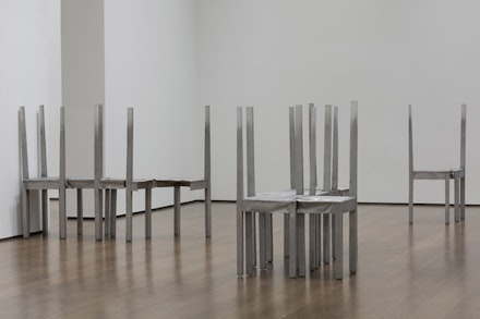 Installation view: <em>Thou-less</em> (detail) and untitled chair works in <em>Doris Salcedo: The Materiality of Mourning</em>, on display November 4, 2016 – April 9, 2017 at the Harvard Art Museums. © Doris Salcedo. Photo: Harvard Art Museums; © President and Fellows of Harvard College.