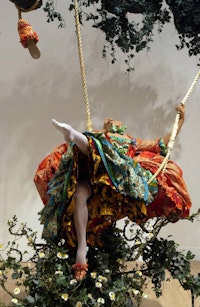 Yinke Shonibare, <em>The Swing (after Fragonard)</em>, 2001. Mannequin, cotton costume, 2 slippers, swing seat, 2 ropes, oak twig, and artificial foliage, approx. 3300 x 3500 x 2200 mm. Photo © Tate Modern.
