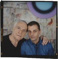 John Giorno and Ugo Rondinone, with painting <em>no. 262 dreiundzwanzigsterjanuarzweitausendundzwei</em> by Rondinone on wall behind. Photo: Peter Ross.
