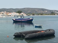 <p>Abandoned refugee boat in Samos harbor. (Photo: L. Bartussek) </p>