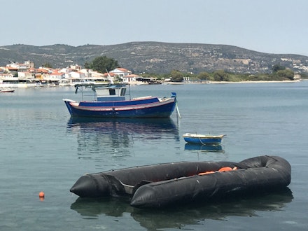 <p>Abandoned refugee boat in Samos harbor. (Photo: L. Bartussek) </p>