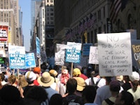 Protesters against the Bush agenda, in midtown on Sunday, August 29, 2004, the day before the RNC began. Photograph by Peter Krebs.