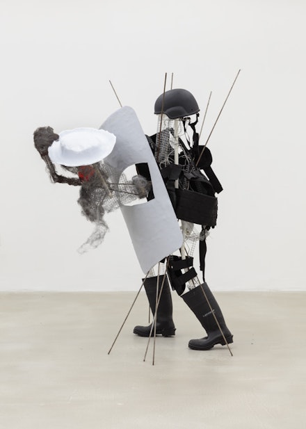Andrew Ross, <em>Hollow Man With Rubber Boots</em>, 2017. Fiberglass, vinyl plastic, wire mesh, steel wool, 48 x 65 x 52 in. Courtesy the artist and American Medium.
		
		
