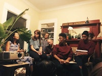 <p>Speakers at the inaugural salon of Living Room Light Exchange's fourth season included Christy Chan (left) and members of The Black Aesthetic: Leila Weefur (second to the right) and Ryanaustin Dennis (right). Oakland, September 19, 2017. Photo by Sophia Wang.</p>