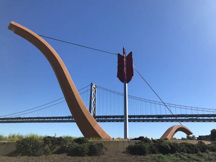 Claes Oldenburg and Coosje Van Bruggen, <em>Cupid's Span</em>, 2002. Stainless steel, structural carbon steel, fiber-reinforced plastic, cast epoxy, polyvinyl chloride foam; painted with polyester gelcoat. 64 ft. x 143 ft. 9 in. x 17 ft. 3/8 in. Commissioned by D&DF Foundation, San Francisco. Installed in Rincon Park, San Francisco, California. (Photo: Lynne Baer)
