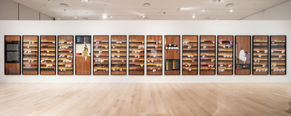 Andrea Zittel, <em>Free Running Rhythms and Patterns, Version II</em>, 2000. Walnut veneer panels, latex and oil based paint, vinyl lettering, and photographs. Olbricht Collection, Essen, Germany. Installation view: “The Everywhere Studio,” Institute of Contemporary Art, Miami, Dec 1, 2017–Feb 26, 2018. Photo: Fredrik Nilsen Studio.