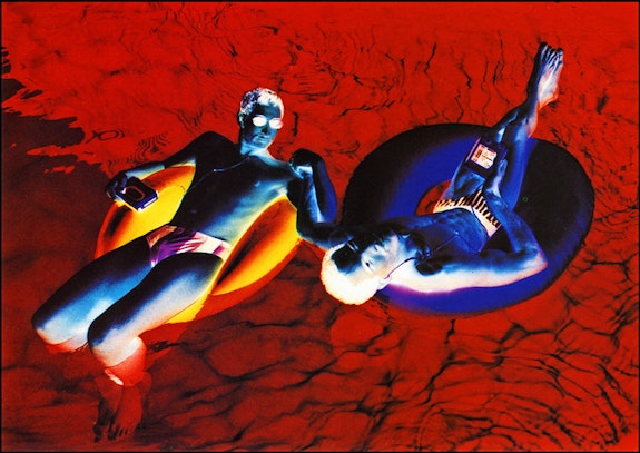 Lola Flash, <em>Stay afloat, use a rubber</em>, Cross-color series, 1993. Original dark room processed photograph, 20 x 24 inches, Courtesy the artist.