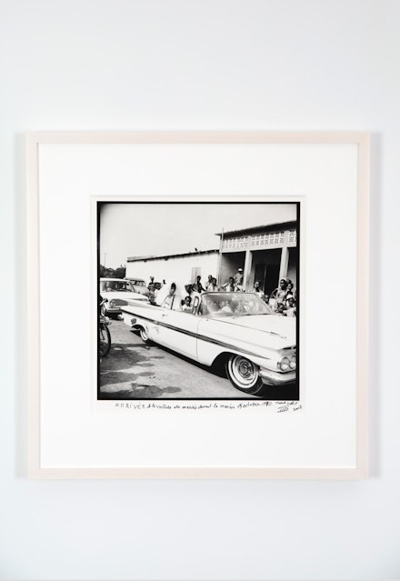 Malick Sidibé, <em>Arrivée de la voiture des mariés devant lamairie 15 Octobre 1970</em>, 1970-2008. Gelatin silver print, 13 1/8 x 13 3/8 inches, signed, titled, and dated on front. Courtesy Jack Shainman Gallery.
