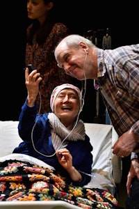 <p>The Rose family's matriarch Masako (Ako) and her husband James (Jay Patterson) in <em>God Said This</em>; background: Emma Kikue as daughter Sophie. Photo: Jonathan Roberts.</p>