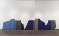 Merrill Wagner, <em>Gorges</em>, 1986. Casein, oil, acrylic, ultramarine, onslate blackboard fragments, 50 x 240 inches. Courtesy Zürcher Gallery, New York.