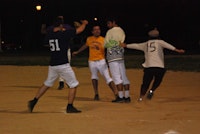 “Hipsters’ Brian Ross thwarts a last ditch scoring opportunity during their 12-11 victory over the Refiners.”