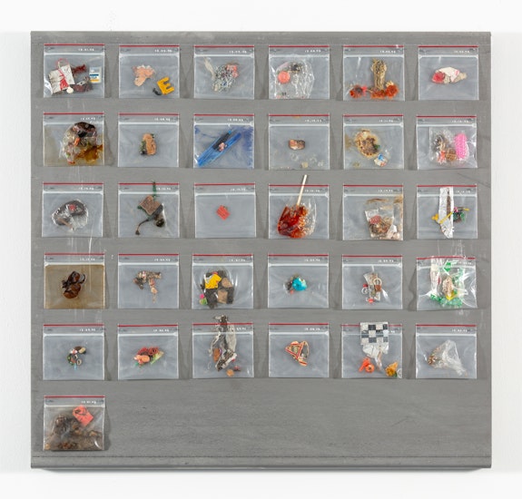 Yuji Agematsu, <em>ziploc: 12.01.95 . . . 12.31.95</em>, 1995. Mixed media in Ziploc bags (31 units), magnets, oil pen, on steel. Ziplocs, 3 3/4 x 4 x 1/2 inches each, steel backing: 29 1/2 x 31 x 1 3/8 inches. Courtesy the artist and Miguel Abreu Gallery, New York. Photo: Stephen Faught.