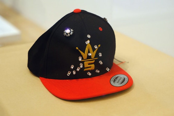 Devin Kenny, <em>Ain't nobody seein' me (IR mask)</em>, 2014. Baseball cap emblazoned with Worldstar Hiphop logo, outfitted with Infrared LEDs, Size 8. Special thanks to Jesse Harding. Courtesy the artist.