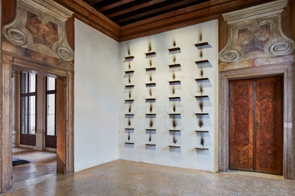 Jannis Kounellis, Untitled, 1984. Iron shelves, soot. Courtesy Fondazione Prada. Photo: Agostino Osio - Alto Piano.