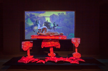 Jacolby Satterwhite, in collaboration with The Fabric Workshop and Museum, Philadelphia, <em>Room for Levitating Beds</em>, 2019. PLA filament, epoxy, epoxy resin, spray mount, aluminized glass beads, HD color video, steel, velour, plywood, vinyl, hot glue, foam tubing, wire, and poly-fil, 48 x 120 x 48 inches. Courtesy the Fabric Workshop and Museum, Philadelphia.