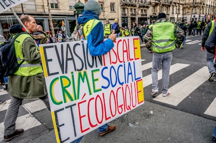 Yellow Vest demonstration in Paris, February 9, 2019. Translation of sign: 