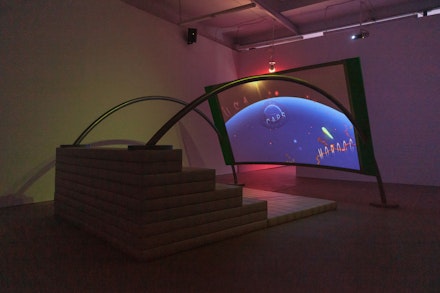 Meriem Bennani, <em>Party on the CAPS</em>, 2018-2019. 8-channel video installation, 30 minutes. Wood wrap around screen, wooden dented screen, steel details (ladder between screens, ladder shape by triangle screen, curved pipe going through screen, magnifying glass with plexi), 9 steel and croco pleather stools with LED lights inside. Curved screen sculpture made of a metal structure, stretched rear project screen, wood stair structure wrapped in foam and croco pleather. Overall dimensions variable. Courtesy the artist and C L E A R I N G, New York / Brussels. Photo: JSP Art Photography.