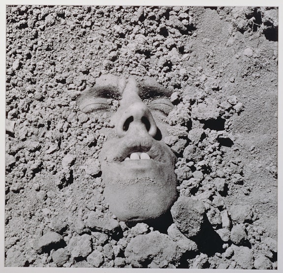 David Wojnarowicz, <em>Untitled (face in dirt)</em>, 1991. Silver print, 19 7/8 x 23 3/4 inches. Courtesy the Estate of David Wojnarowicz and P·P·O·W, New York.