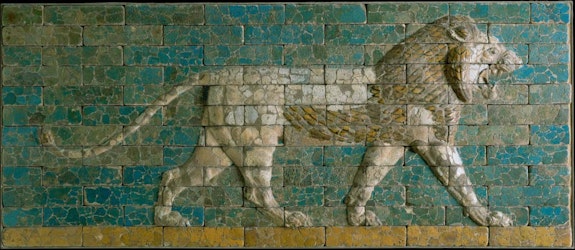 Reconstructed panel of bricks with a striding lion, Neo-Babylonian Period (reign of Nebuchadnezzar II, 604-562 BCE). Molded and glazed baked clay, Processional Way, El-Kasr Mound, Babylon, Iraq. Courtesy The Metropolitan Museum of Art, New York.