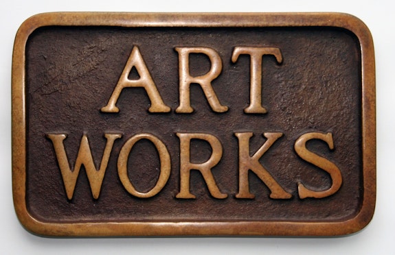Stephen Kaltenbach, <em>ART WORKS (Sidewalk Plaque)</em>, 1968. Bronze, 5 x 8 inches, approximately. Edition of 100. Courtesy the artist.