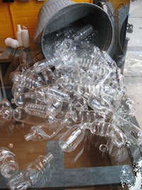 “Damn Squirrels” (2007). Flameworked glass and metal garbage can. 65 elements, dimensions variable.