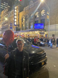 Kyle Turner outside the marquee for the Company revival, seen on Broadway earlier this year. Courtesy the author.