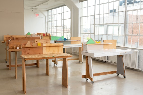 Gedi Sibony, <em>The Terrace Theater</em>, 2019–20. Salvaged wood, paint, metal screws, casters, 56 x 143 x 338 inches. Courtesy the artist and Greene Naftali, New York.