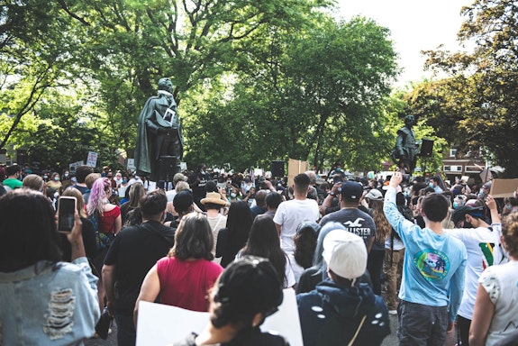 Protestors rallied in front of the statues at Academy Green in Kingston in response to the murder of George Floyd and to demand an end to police surveillance and brutality in the city. Photo: Stephanie Alinsug. 