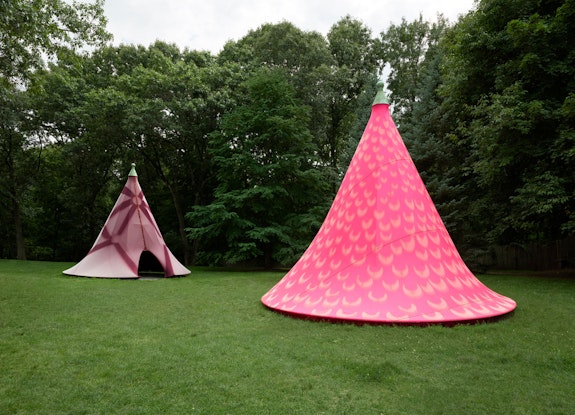 Installation view: <em>Leeza Meksin: Turret Tops</em>, with sun-bleached patterns unveiled, summer 2020, deCordova Sculpture Park and Museum, Lincoln, MA, 2020. Neoprene and galvanized steel, 240 x 246 inches. Courtesy the artist. Photo: Julia Featheringill Photography.