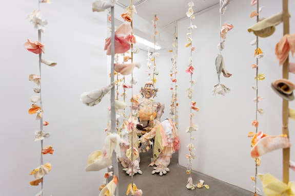 Tau Lewis, <em>Delight</em>, 2020. Various recycled and hand dyed fabrics, recycled leather, cotton and recycled polyester batting, acrylic paint, PVA glue, seashells, stones, beads, pipe, wooden chair, hand sewn, dimensions variable. Courtesy the artist and Cooper Cole Gallery. 