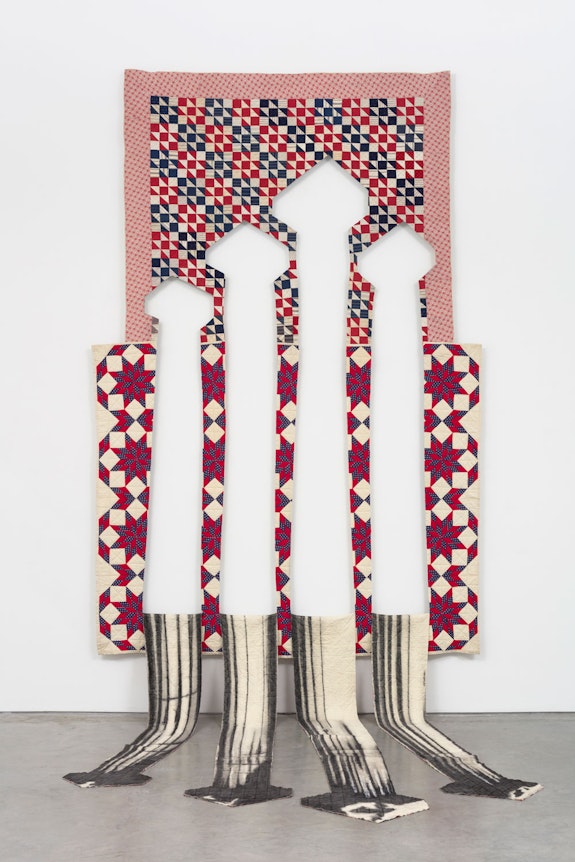 Sanford Biggers, <em>whence/wince</em>, 2020 Antique quilts, charcoal 149 7/8 x 91 3/8 x 98 in. Courtesy the artist and Marianne Boesky Gallery, New York. 