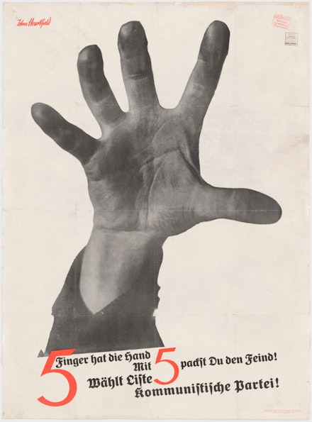 John Heartfield (born Helmut Herzfelde), <em>The Hand Has Five Fingers (5 Finger hat die Hand)</em> (Campaign poster for German Communist Party), 1928. Lithograph, printed by Peuvag-Druckerei, Berlin. 38 1/2 x 29 1/4 inches. The Museum of Modern Art, New York.