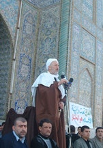 Sheikh Abbas holds a sword symbolizing the Shia struggle for justice as he addresses thousands of followers, February 2004.